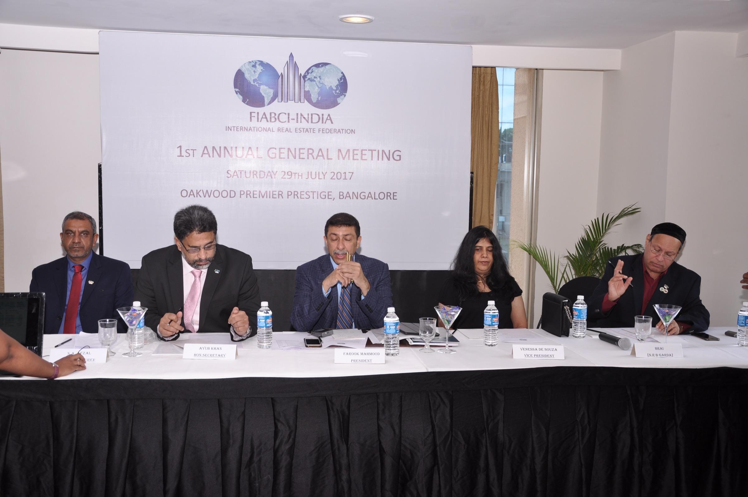 President Farook Mahmood addresses the meeting, flanked by Hon. Secretary Ayub Khan and Vice President Vanessa De Souza.
